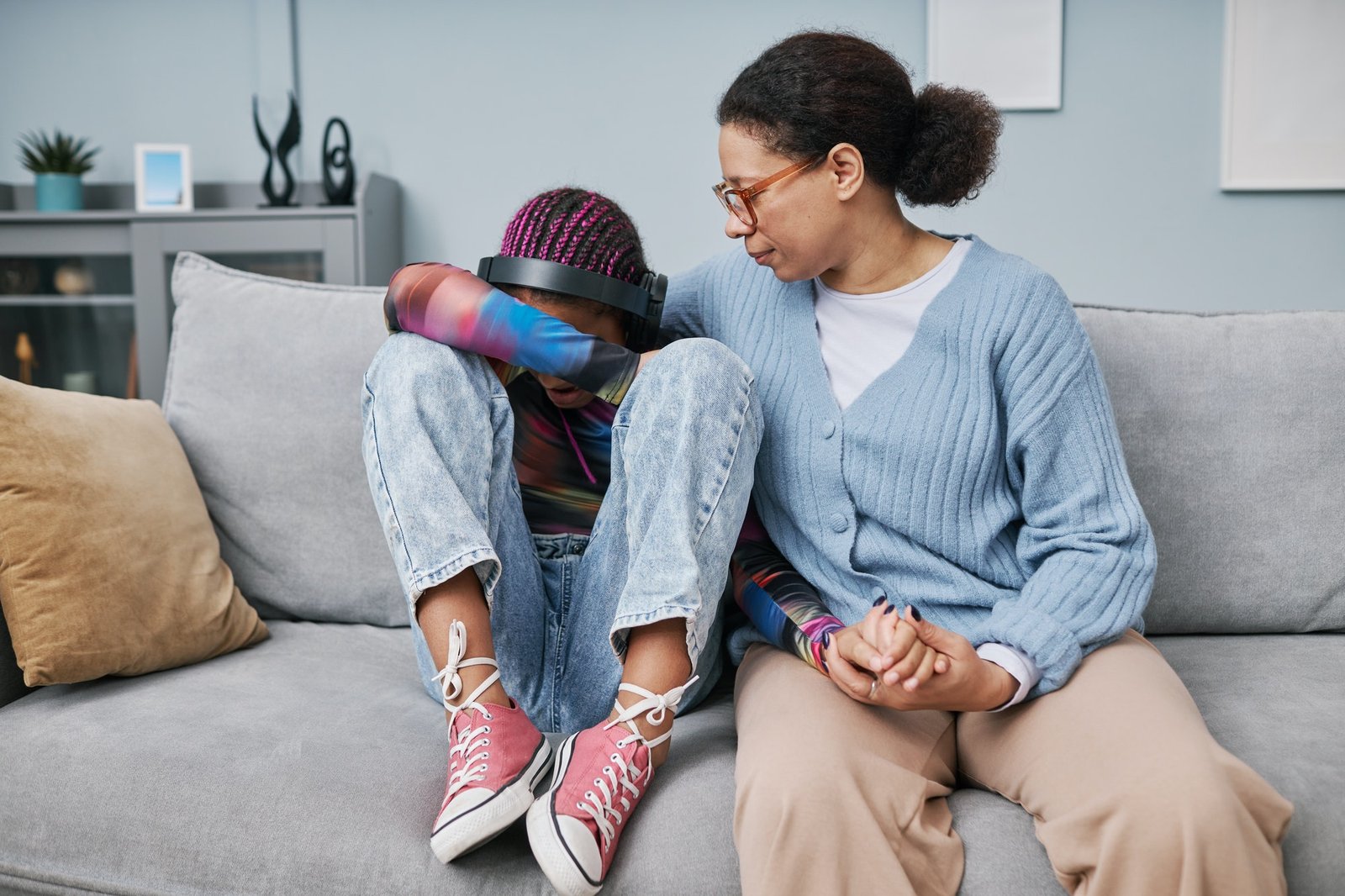 Crying teenager with mother